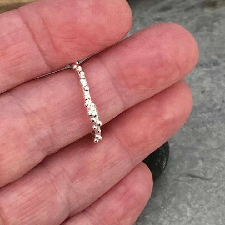 Thin silver ring band with tiny bubbles 7