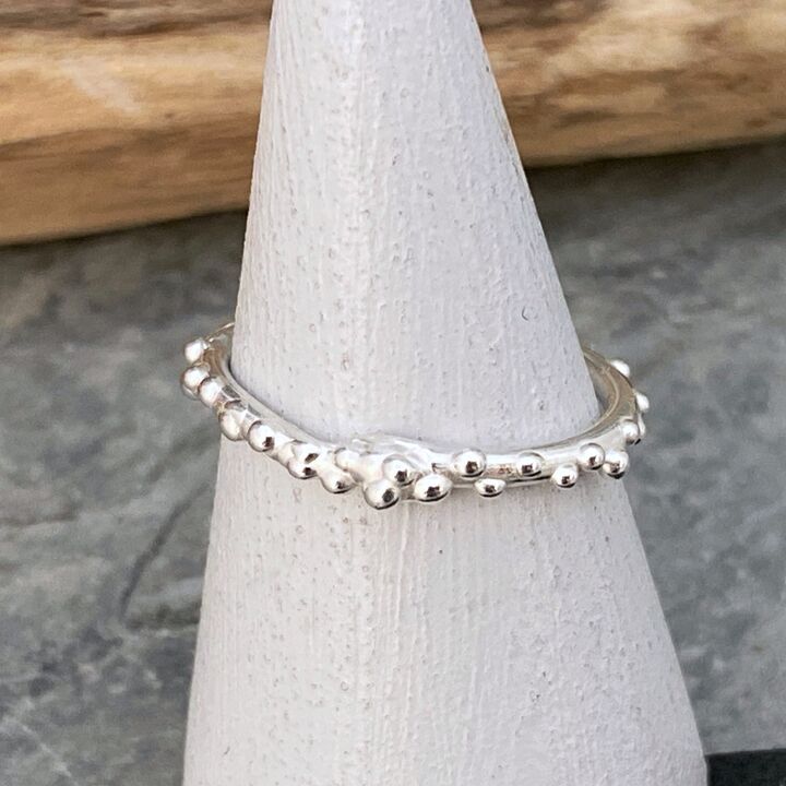 Thin silver ring band with tiny bubbles