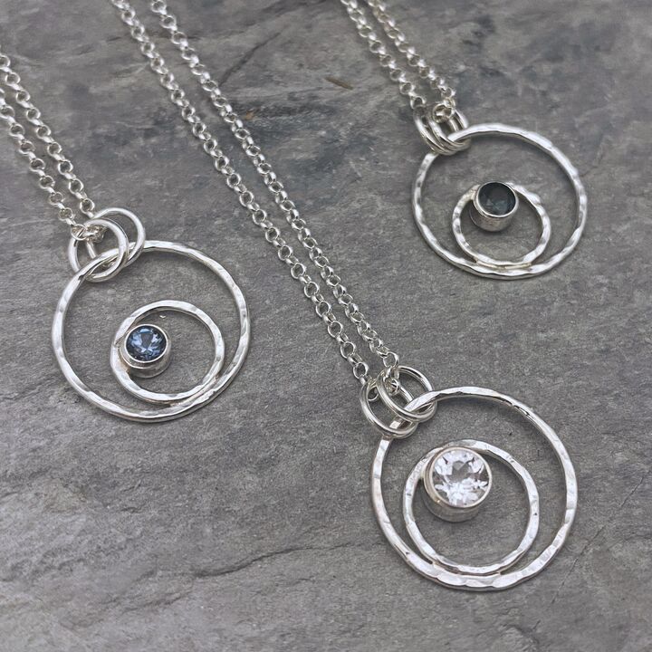 Small silver circles pendant with a Topaz gemstone