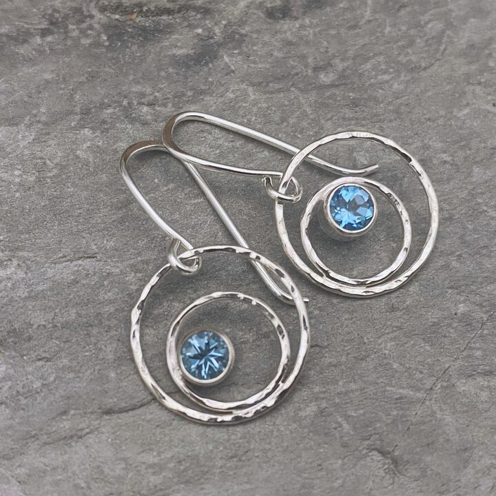 Silver circle earrings with topaz stones