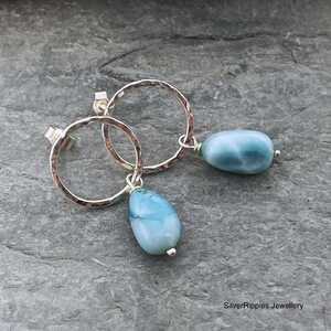 This is an image of a pair of Larimar and silver earrings